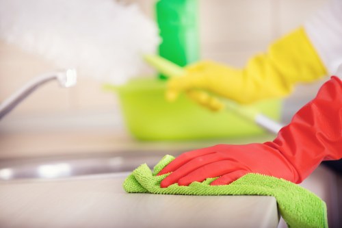 Cleaner working in a Barnes apartment with access and parking considerations